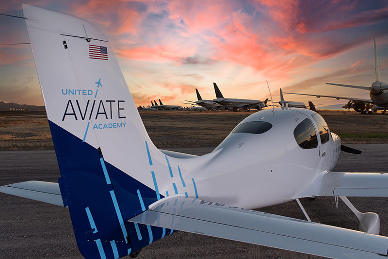 United Aviate Academy training plane with sunset